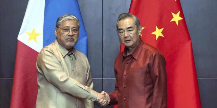 Wang Yi discusses bilateral challenges with Manalo