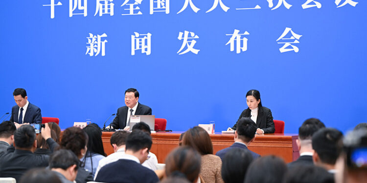 China's national legislature passes 24 law bills over past year