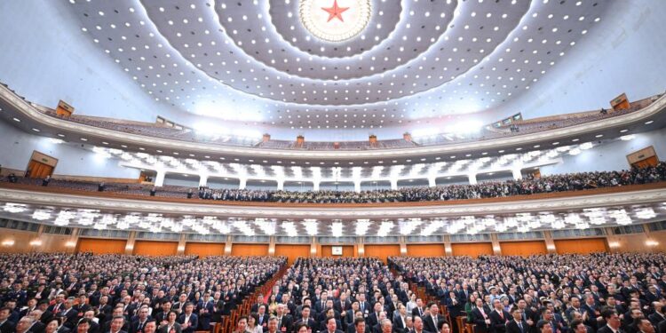 China's national legislature holds closing meeting of annual session