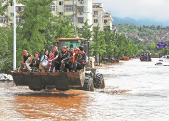 Hundreds Rescued in Beijing as Workers Deployed a Makeshift Bridge